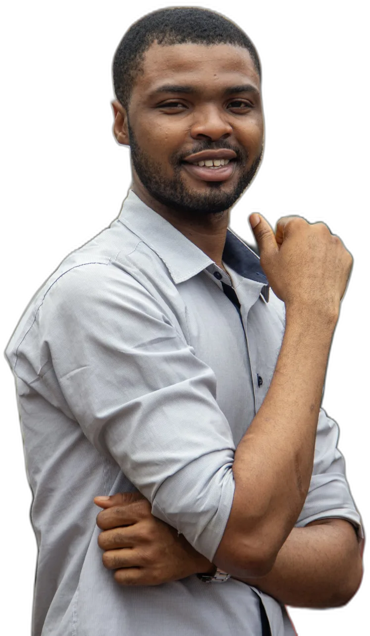 A smiling man in a grey shirt with his arms folded
